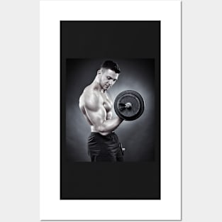 Athletic man working out with heavy dumbbells Posters and Art